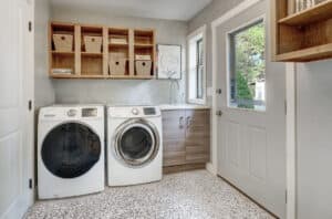 Laundry room with beautiful shelving and natural tones.