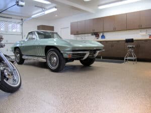 Green corvette in garage with OGI flooring