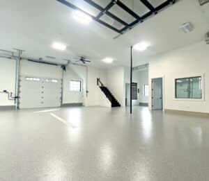 Updated garage with OGI flooring and staircase