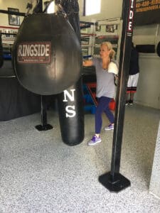 Woman punching bag