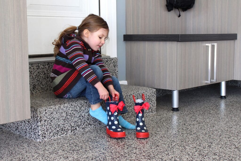 GIrl putting boots on