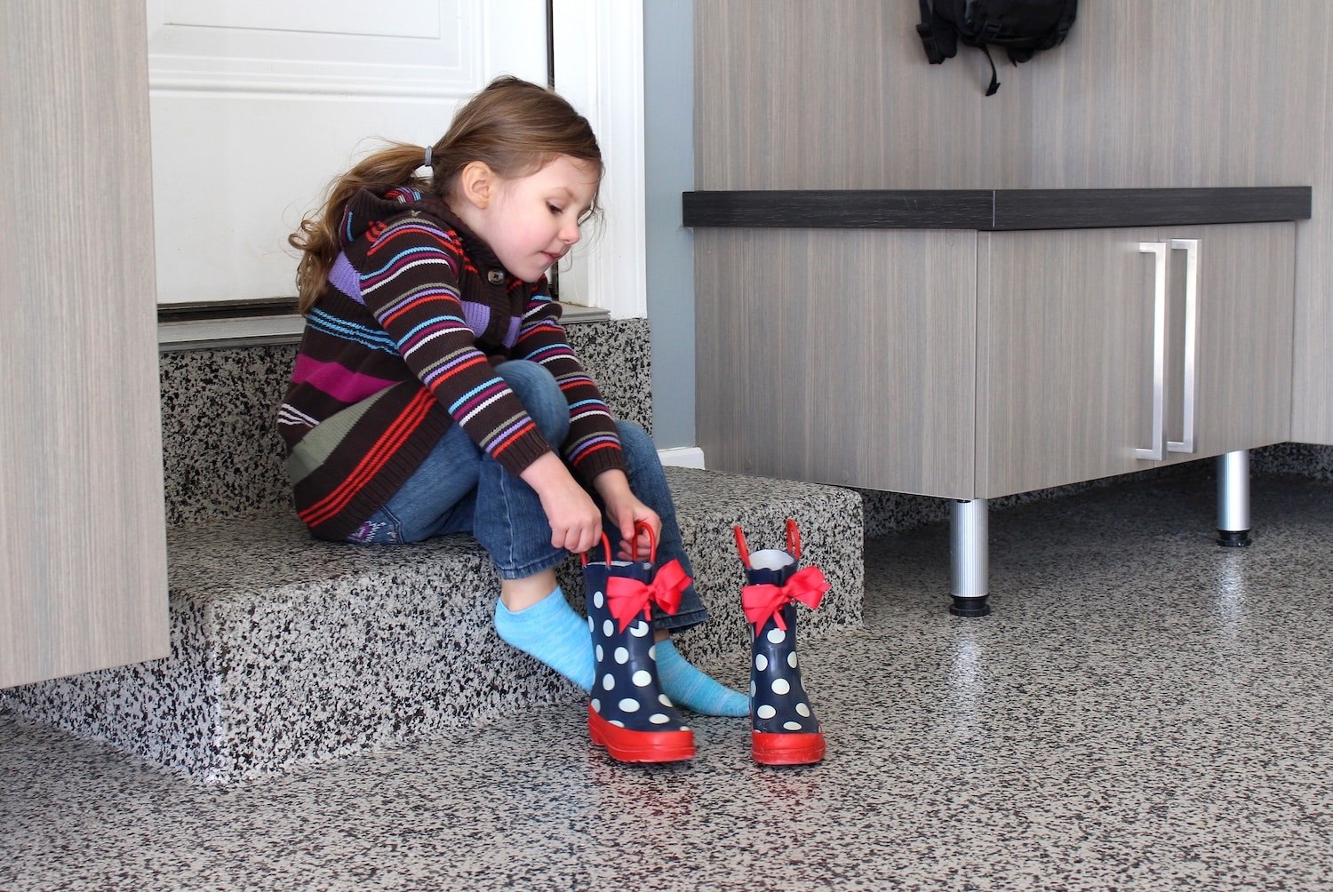 GIrl putting boots on